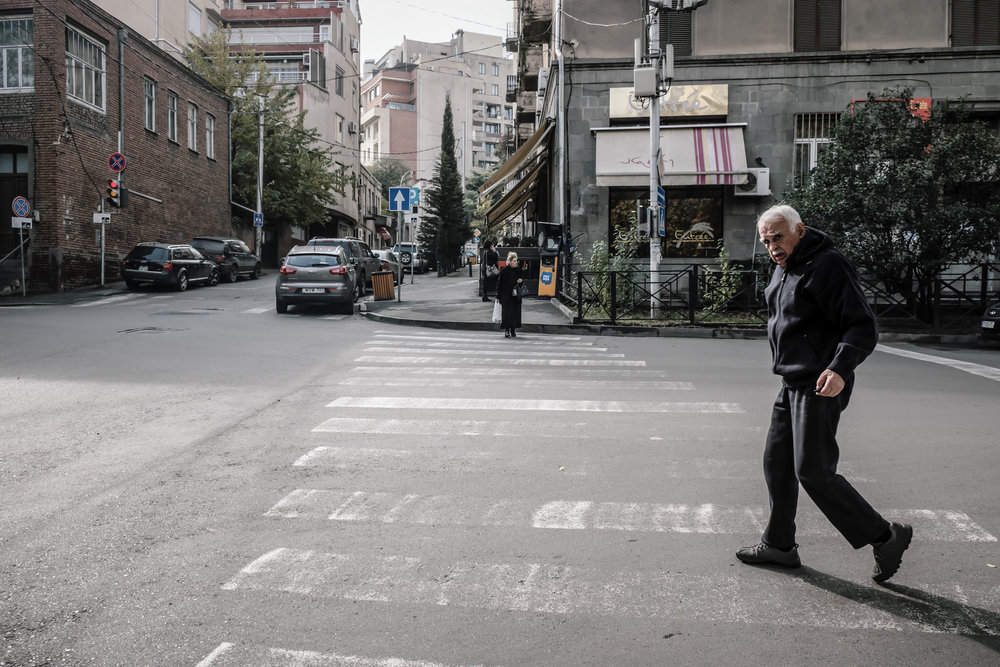 A man crossing a street