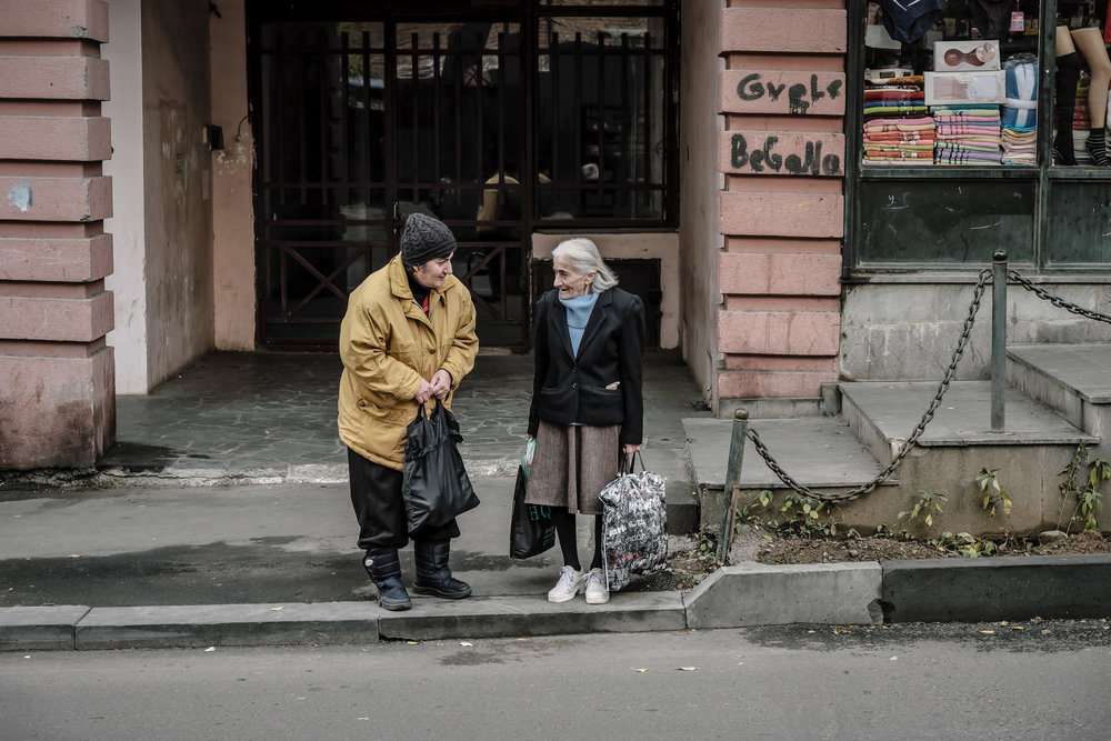 two elderly women talking