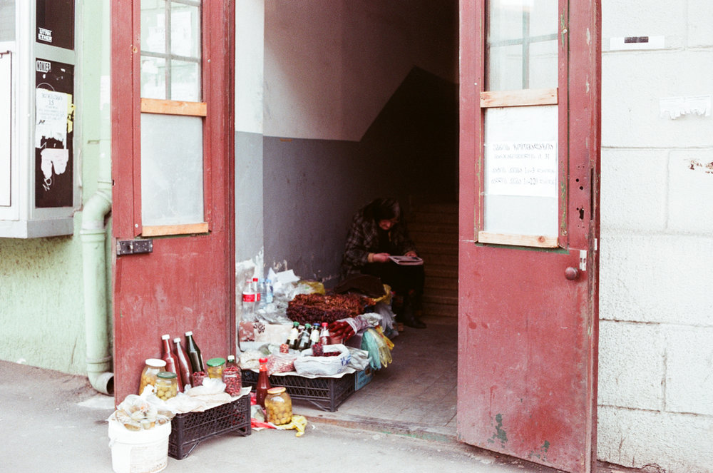 a woman selling food on the street