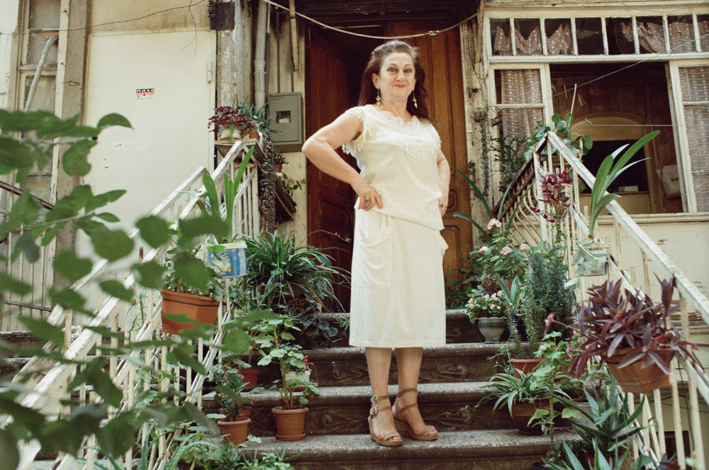 a woman on the stairs of her house